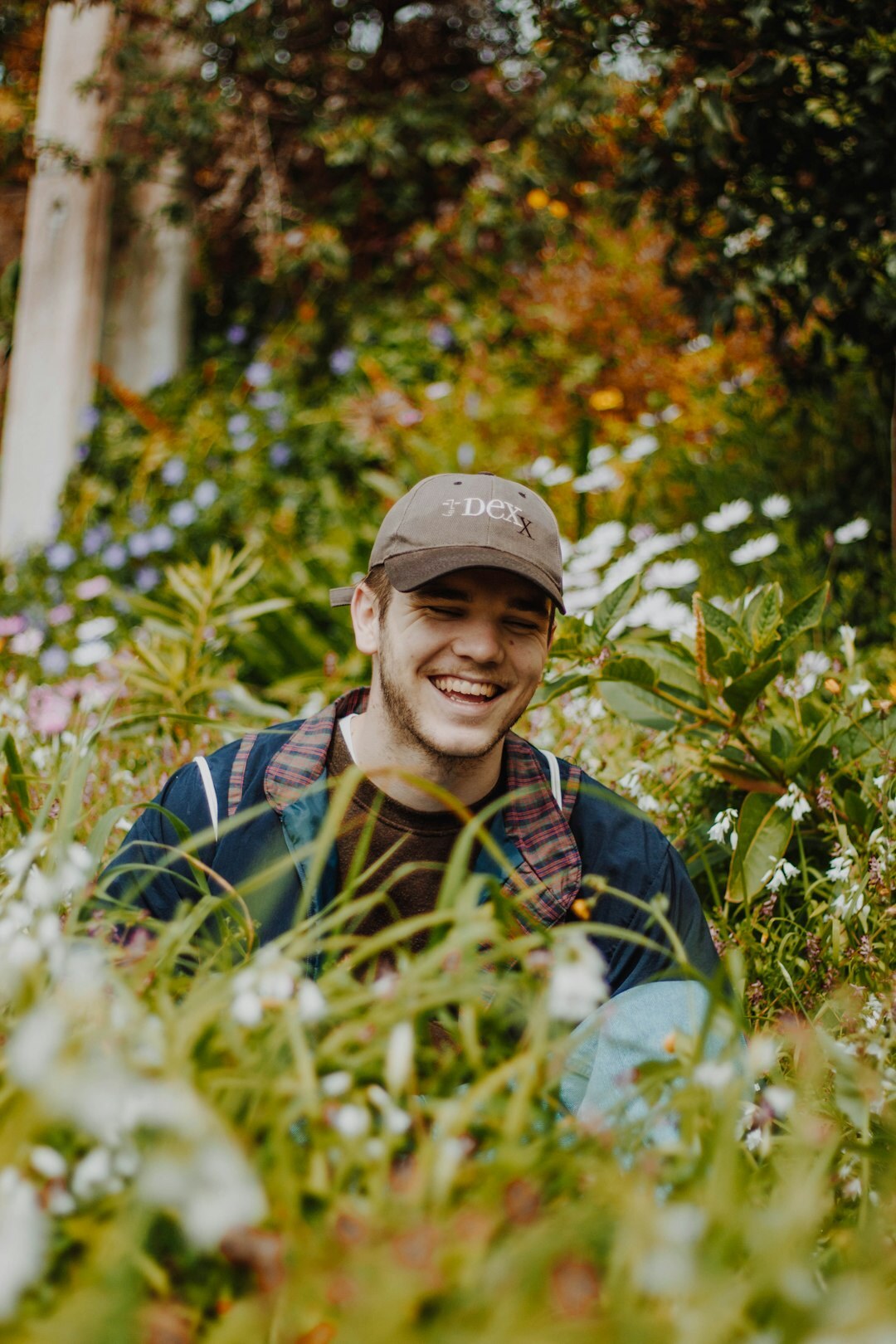 Portrait of a Lithuanian woman gardening expert in her fifties smiling in a garden